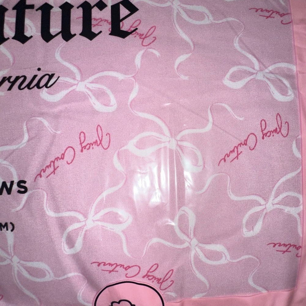 Juicy Couture pink bow pillow